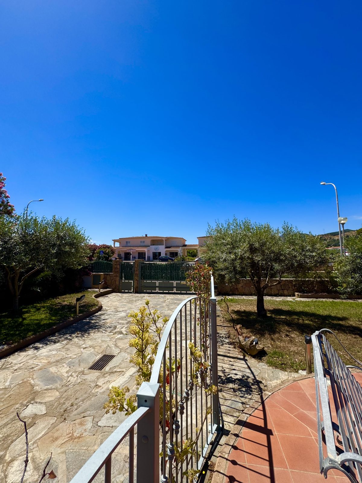 Paved entrance and gate of Oasi del Mare — vacation rental in San Teodoro, Sardinia