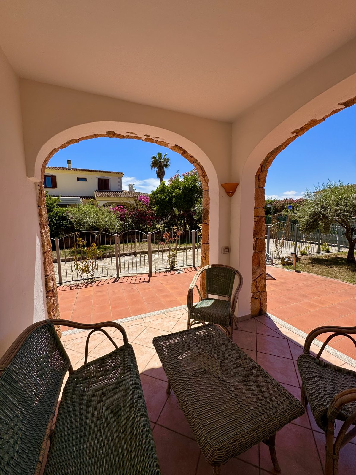 Arched veranda with armchairs at Oasi del Mare — vacation rental in San Teodoro, Sardinia