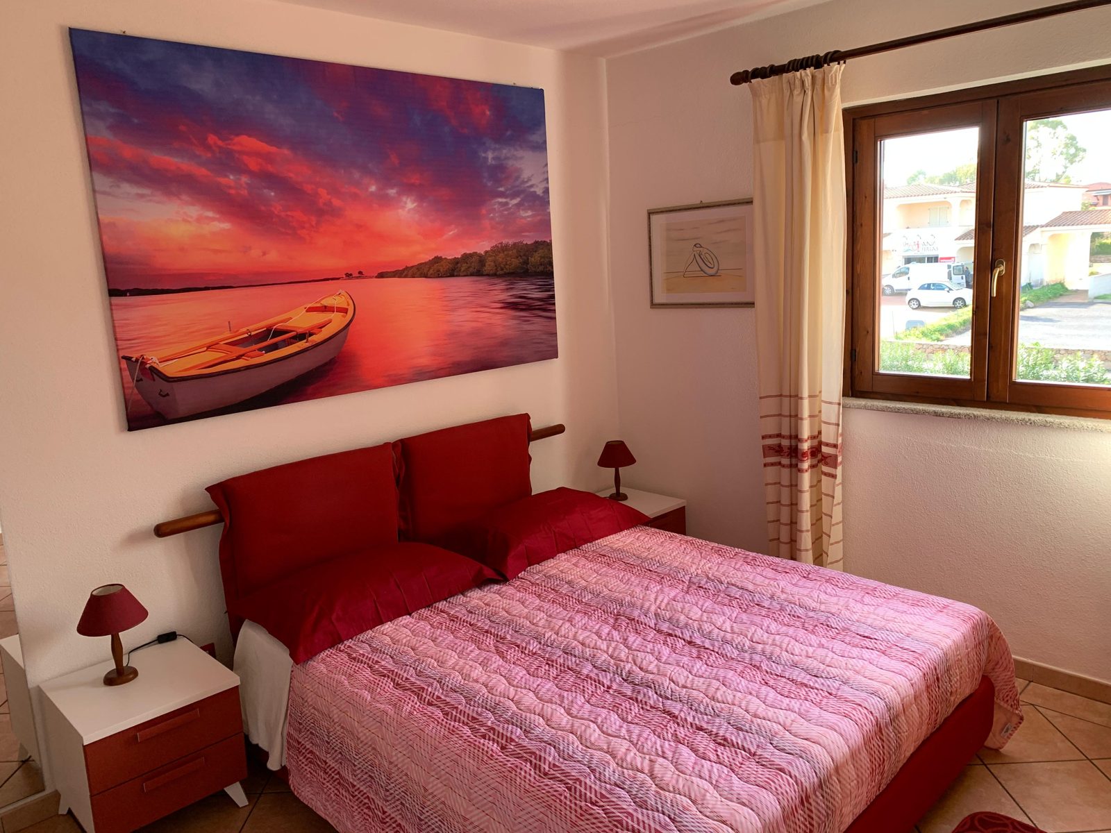 Double bedroom with sea artwork at Terrazza sul Mare — vacation rental in San Teodoro, Sardinia