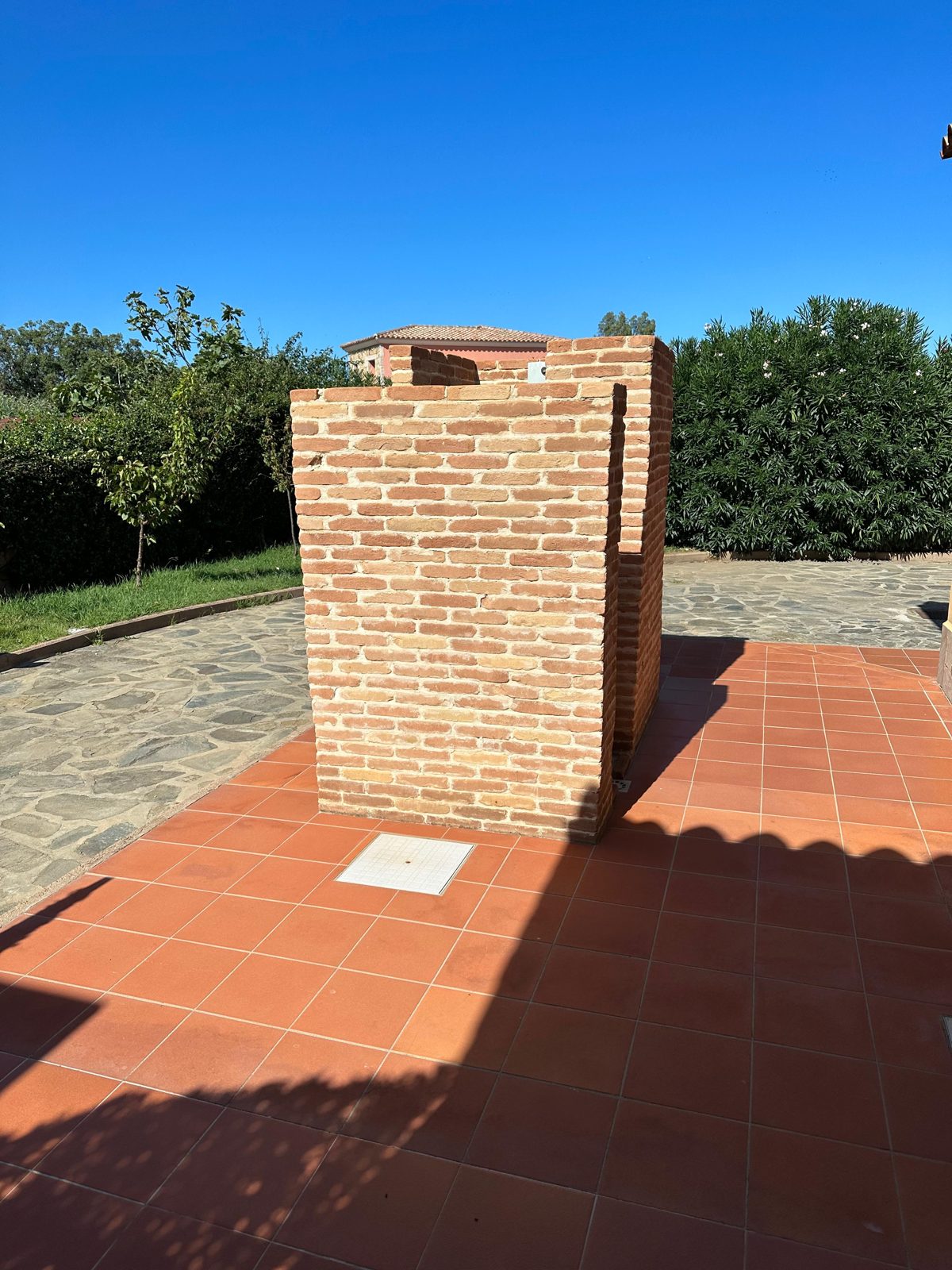 Terracotta terrace with barbecue at Casa del Sole — vacation rental in San Teodoro, Sardinia