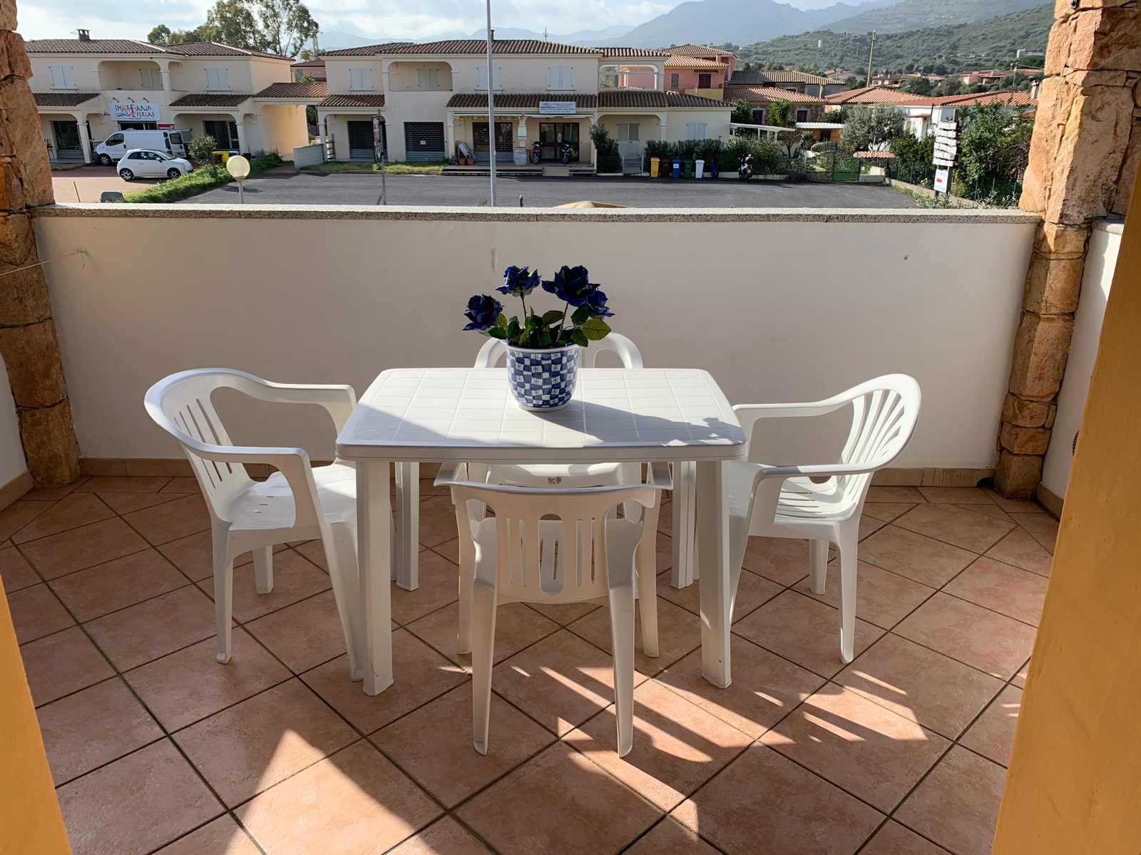 Sunny terrace of Terrazza sul Mare with table and chairs — vacation rental in San Teodoro, Sardinia