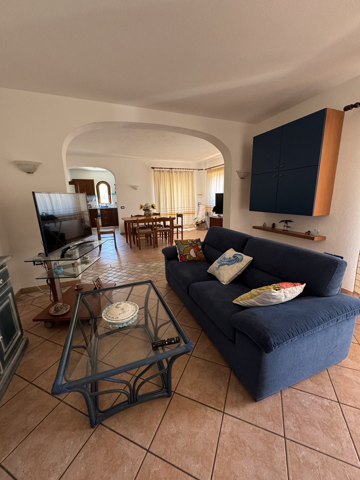 Living area with seating and open dining room at Oasi del Mare — vacation rental in San Teodoro, Sardinia