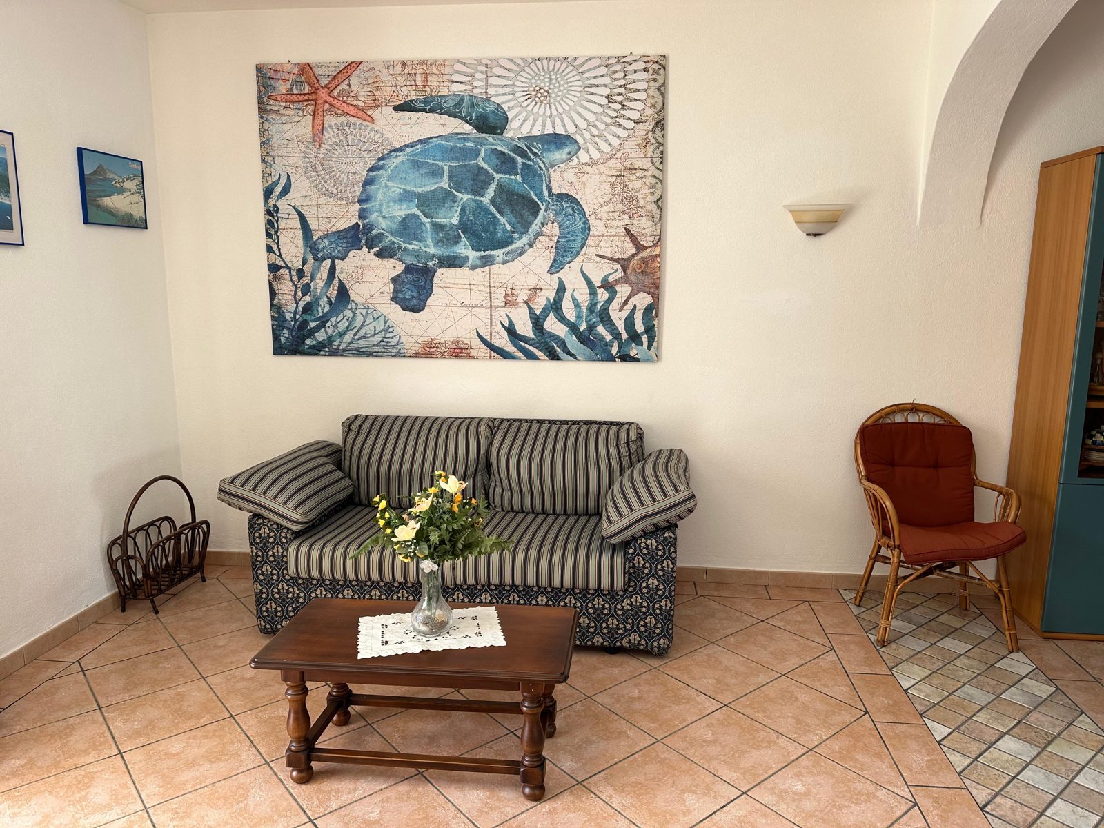 Living room with sofa and seating at Casa del Sole — vacation rental in San Teodoro, Sardinia