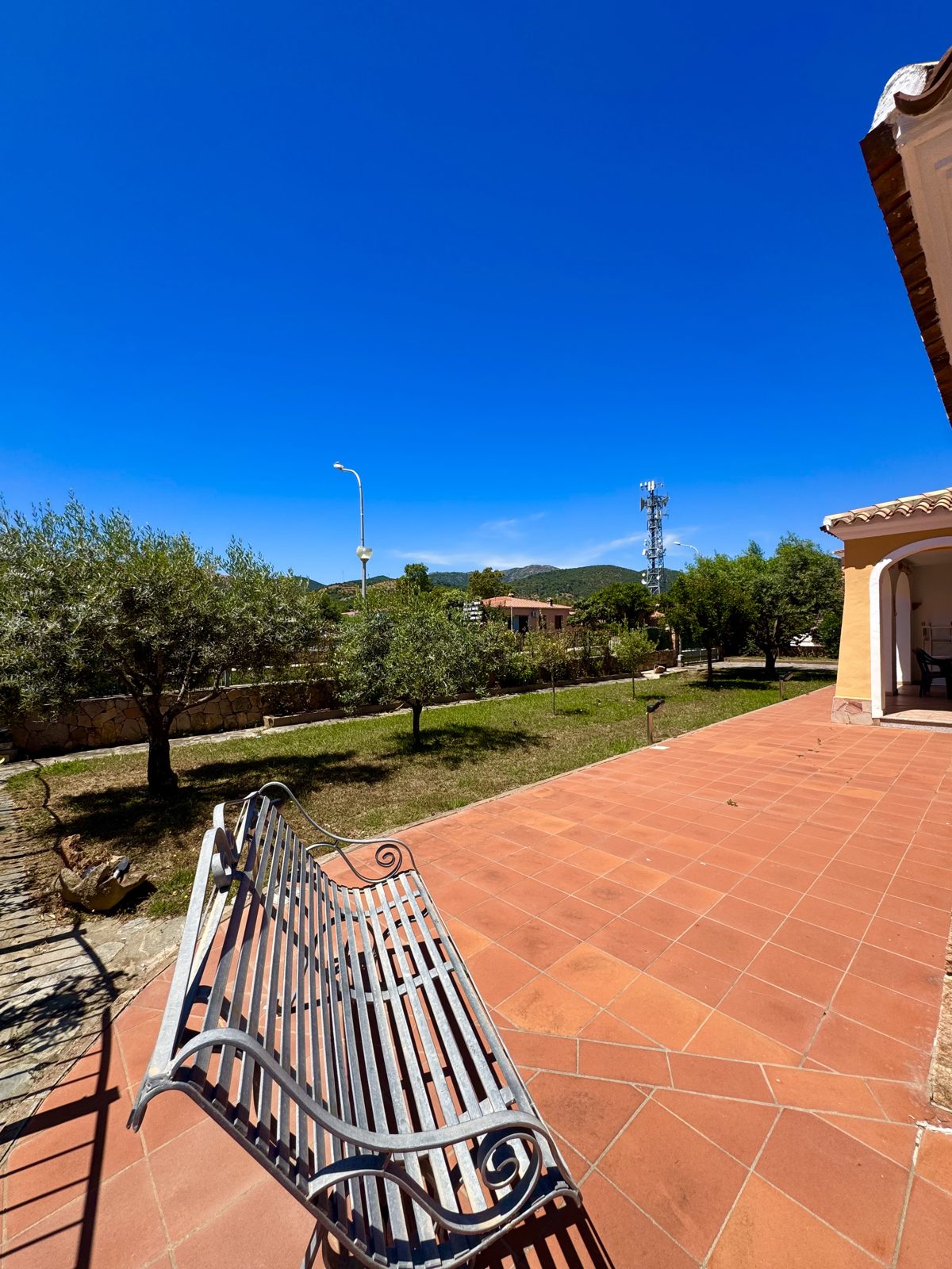 Exterior of Oasi del Mare with terrace and olive trees — vacation rental in San Teodoro, Sardinia
