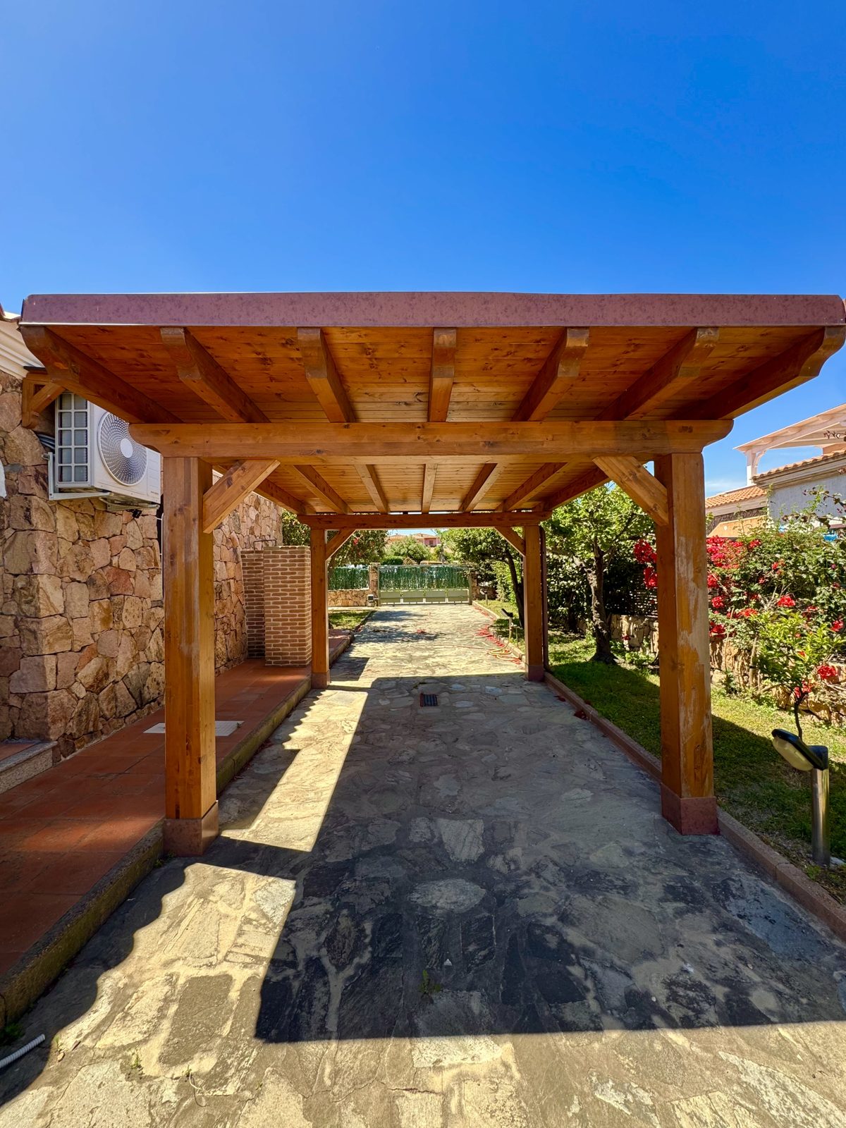 Covered wooden carport at Oasi del Mare — vacation rental in San Teodoro, Sardinia