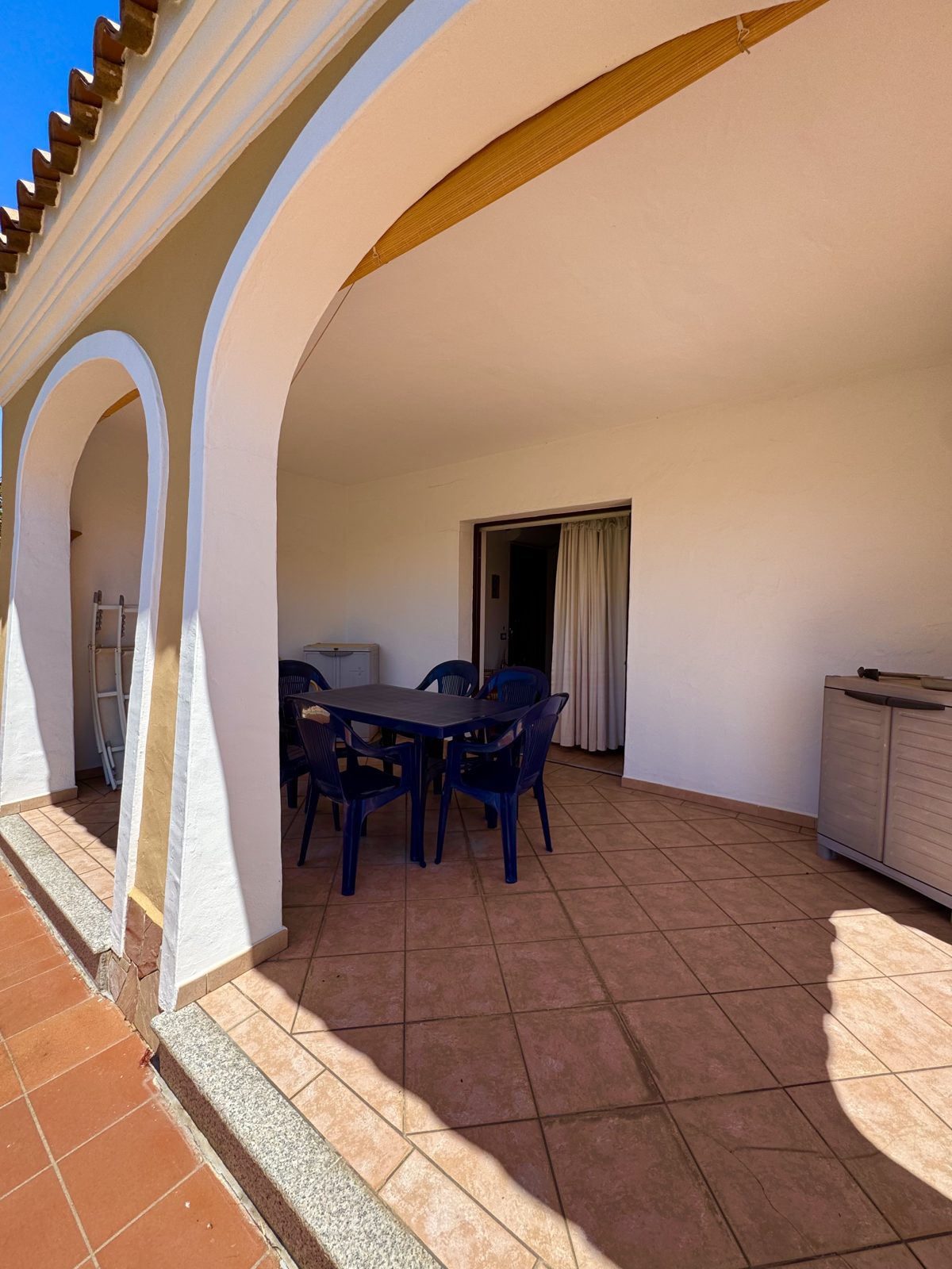 Shaded porch leading to the dining area at Oasi del Mare — vacation rental in San Teodoro, Sardinia